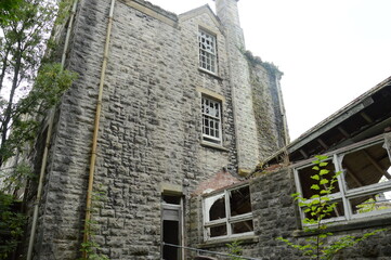 the outside of an abandoned asylum in wales