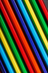 The texture of multi-colored pencils is close-up in full screen.