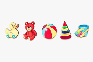 Obraz premium Children's puzzles made of wood. Childrens toys made of wood on a white background. Children's pictures. Educational toys.