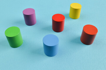 Colorful wooden cube blocks isolated on a blue background