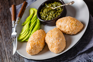 Baked white fish cakes with avocado and sauce