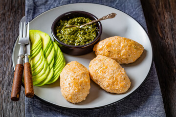 Baked white fish cakes with avocado and sauce