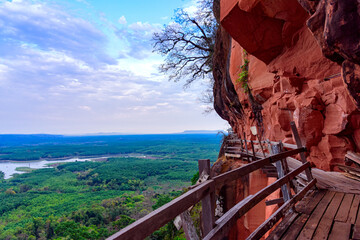 Phu Thok or Chetiyakiri Temple Beautiful mountain with rocky cliffs in Bueng Kan Province, Thailand.