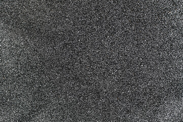 Fototapeta premium Gray surface with fine texture and white dots. Abstract neutral background for design. Backdrop
