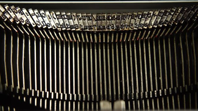 Mechanism of a retro typewriter. Old typewriter hammers. Close up.