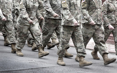 US soldiers. US army. Military forces of the United States of America.   Soldiers marching on the parade. Veterans Day. Memorial Day.