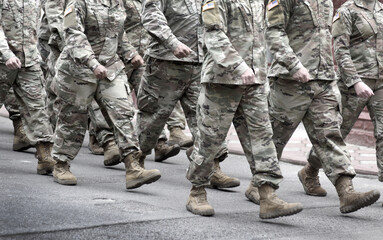 US soldiers. US army. Military forces of the United States of America.   Soldiers marching on the...