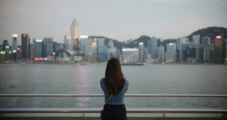 Fototapeta na wymiar Woman look at Hong Kong city