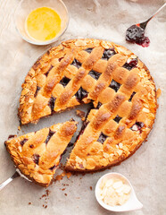 Linzer Torte top view on white background. Freshly baked homemade typival Austrian Pie made with red currant jam  almonds and hazelnuts