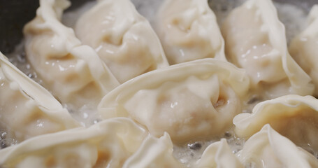 Grill dumpling in pan at kitchen