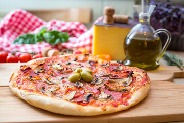pizza focaccia capricciosa on table with props