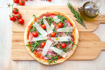 pizza focaccia with tomatoes, cheese and rucola