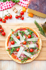 pizza focaccia with tomatoes, cheese and rucola