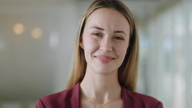 portrait happy caucasian business woman smiling enjoying successful career proud entrepreneur in office workplace testimonial 4k footage