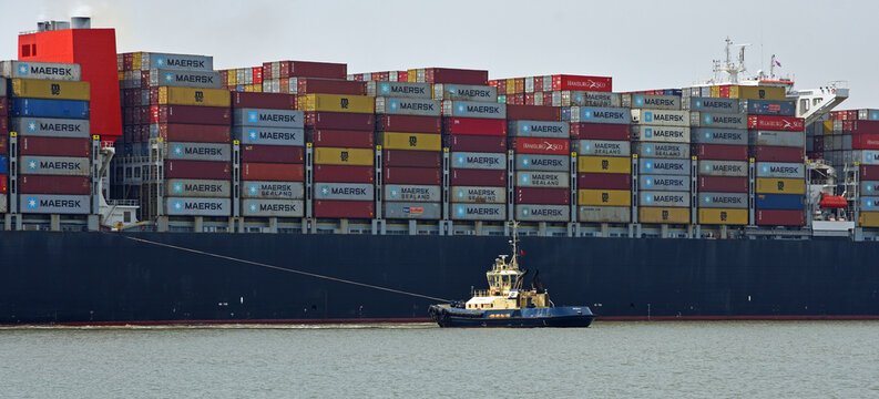 The container ship Maersk  Edirne  being turned by tug boats at the port of Felixstowe.