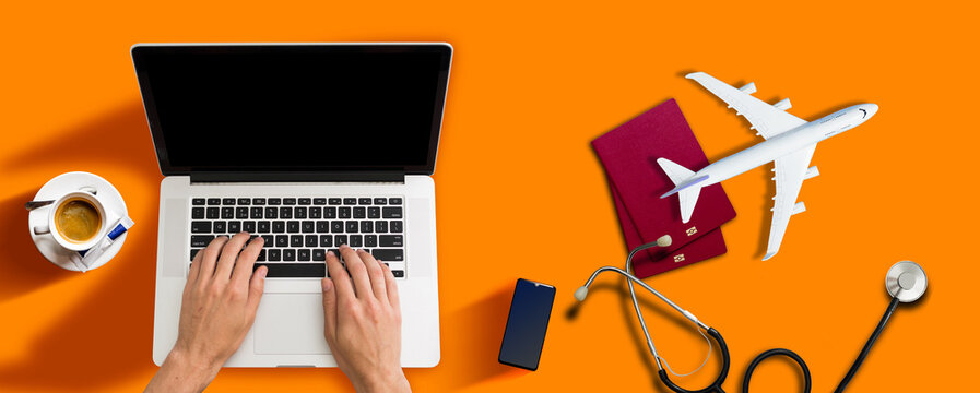 Mock up image of medical stethoscope, passport, laptop computer, air plane isolated on orange background.Trip, travel and insurance concept.