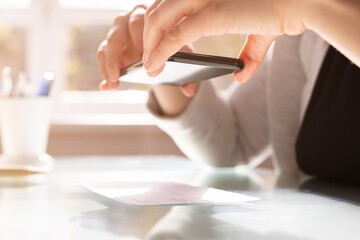 Fototapeta premium Remote Payroll Cheque Deposit Taking Picture