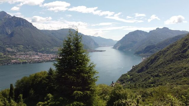 Aerial panoramic view of Lake Como and the surrounding mountains on a sunny day, Civenna, Lombardy, Italy