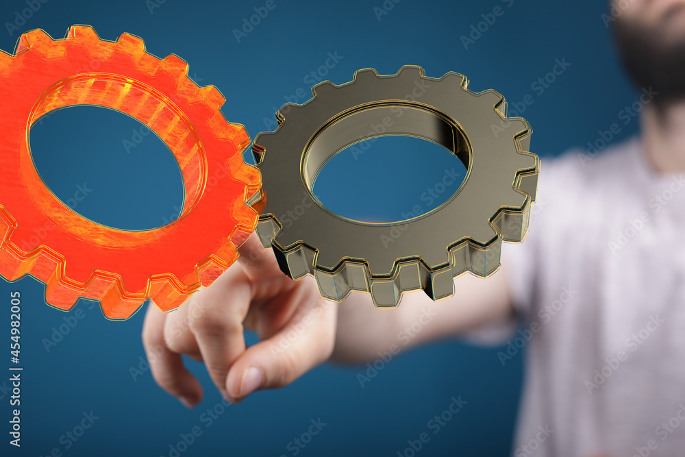 Poster Man draws gears on virtual screen. Blurred Abstract engine room..