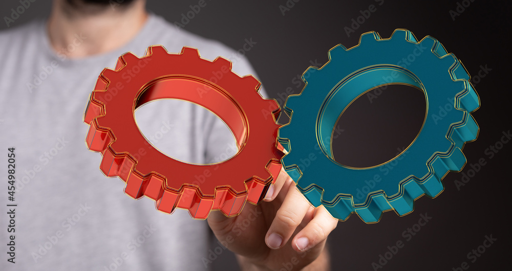 Aufkleber Man draws gears on virtual screen. Blurred Abstract engine room..