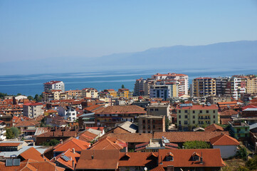Naklejka na ściany i meble Pogradec is located on banks of the Lake of Ohrid. Morning view of the city from the mountain. Pogradec. Albania.