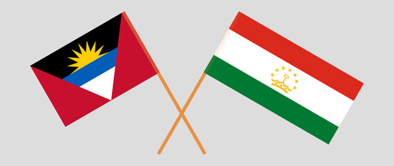 Crossed flags of Antigua and Barbuda and Tajikistan. Official colors. Correct proportion