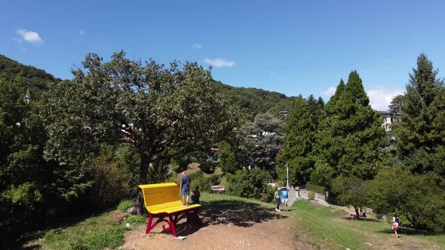 Aerial view of A big bench installed overlooking Lake Como at Civenna, Lombardy, Italy