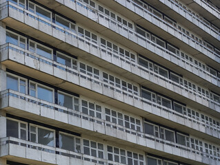 Facade of an ancient sanatorium. View of balconies and windows. Closed resort with ancient architecture. 
