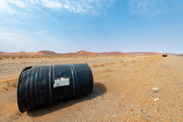 Carelessly disposed of bins at the roadside in the desert on the way between Sesriem and...