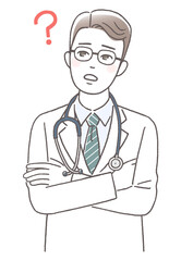 腕組みして考えている医師