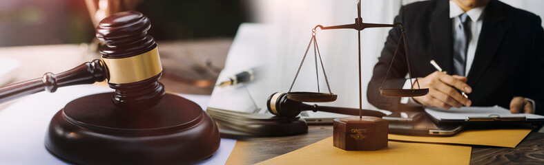 Business and lawyers discussing contract papers with brass scale on desk in office. Law, legal...