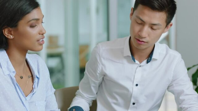 beautiful business woman team leader training asian intern writing notes female executive sharing ideas teaching colleague in office 4k