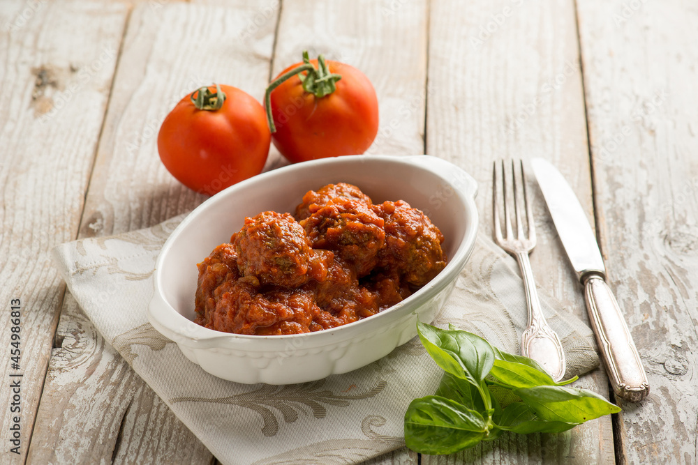 Poster bowl with meat balls and tomato sauce