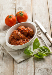 bowl with meat balls and tomato sauce