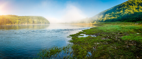 Calm morning scene in summer on the Dniester river.