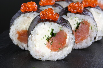 roll with salmon and red caviar