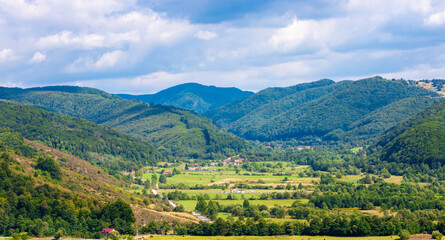 landscape with a village between the mountains of Transylvania