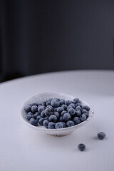 blueberries in a white bowl - copy space