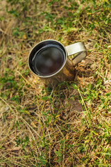 mug of tea standing on the grass