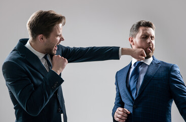 disagreed men business partners fighting aggressive and angry while conflict, knockout.