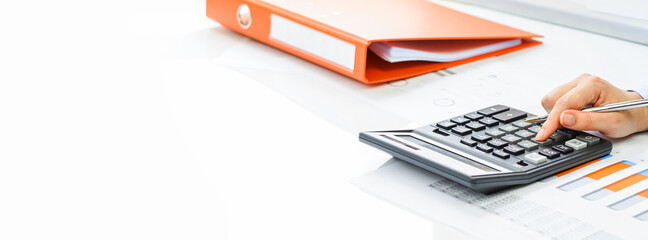 Finance and business concept. Hand pointing at statistics chart. laptop on financial graphs on...