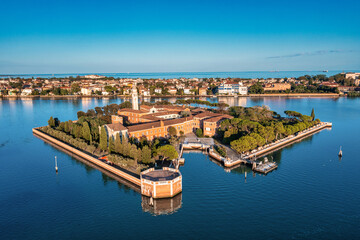 Fototapeta na wymiar Flying over small Venice islands located in the middle of the Venetian lagoon. Beautiful aerial view of Venice.