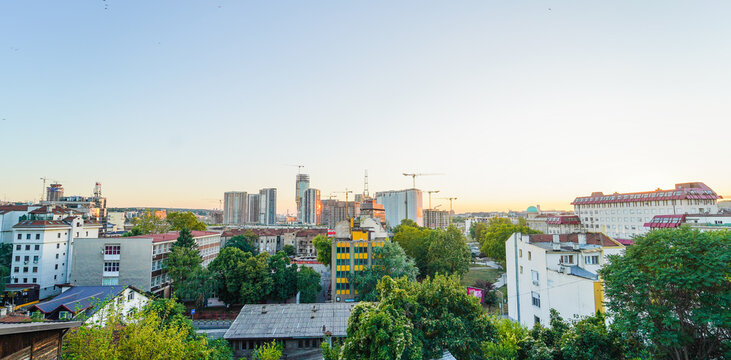 Wider image of Belgrade cityscape panorama during late summer evening looking at the new waterfront development and new buildings construction