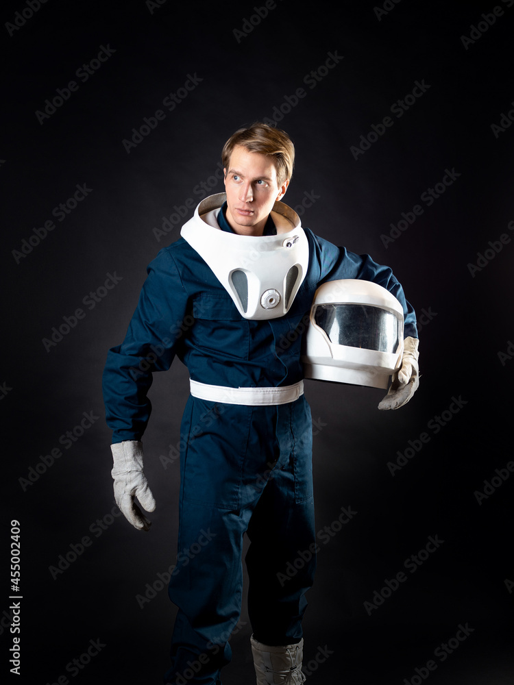 Wall mural an astronaut in a spacesuit is ready for launch.
