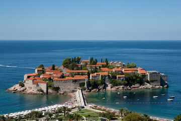 Fototapeta na wymiar Beautiful view of the island of St. Stephen at sunny day, Montenegro. Aman Sveti Stefan, Budva