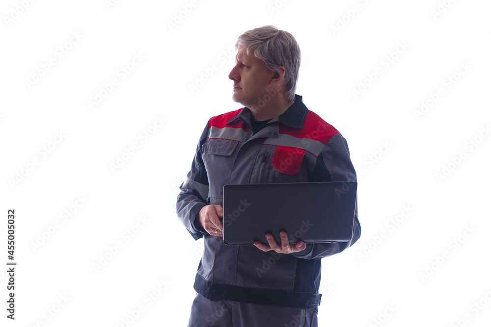 Poster gray-haired computer technician on white background. he will set up laptop while standing. computer 