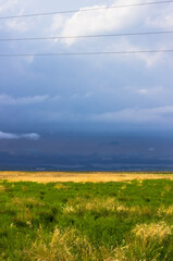 Beautiful landscape with a dark stormy sky. vertical photo. nature of russia. Far East.