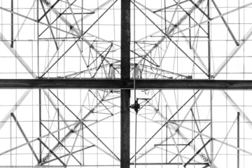 Looking upwards at an electricity tower