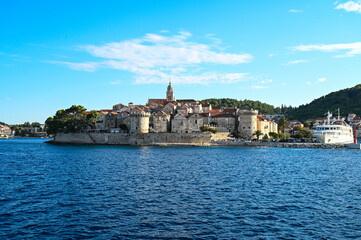 Historic town of Korcula, Croatia. Stone walls, towers, houses and buildings in old town. Adriatic sea and island of Korcula. 