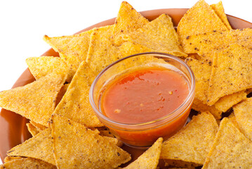 Plate of freshly made spicy nachos with salsa